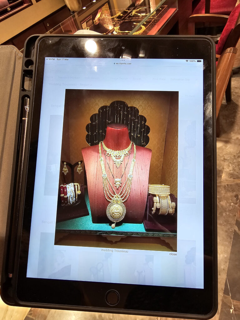 A photo of a necklace on display showing on a tablet screen