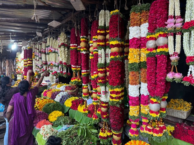 Flower necklaces on display at a street market