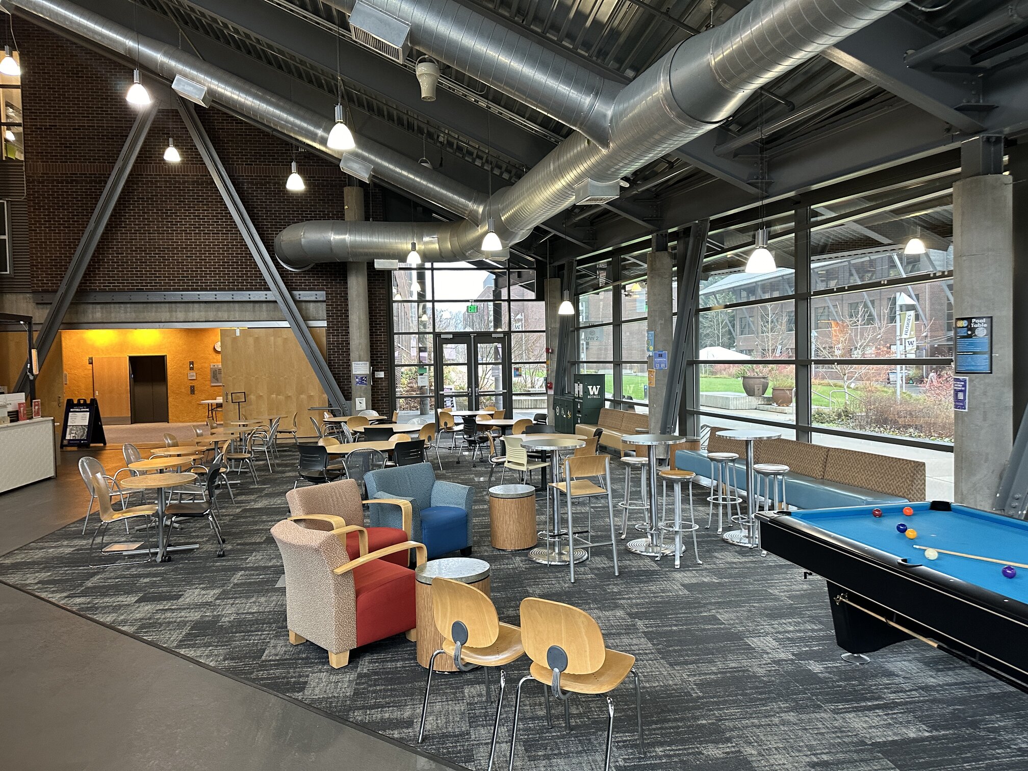 Commons area for socialization. Various sized tables with chairs in a cafe style setting. Located in front of the Gold Brew Cafe in UW2. Pool table for recreational use.