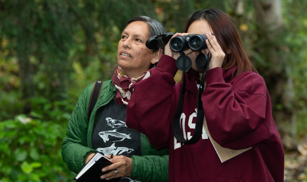 Ursula Valdez and student birdwatching.